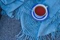 close up of cup of tea with blue stripes at home ,teatime and relax