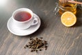 Close up of Cup of tea with lemon, ginger and honey on wooden rustic table Royalty Free Stock Photo