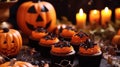 Close-Up Of Cupcakes And Pumpkin On Table During Halloween Celebration.