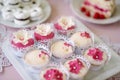Close up, cupcakes on tray decorated with pink flowers Royalty Free Stock Photo