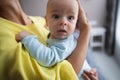 Adorable baby in arms of his mother stock photo Royalty Free Stock Photo