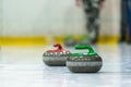 Close up of a Curling game situation. Royalty Free Stock Photo