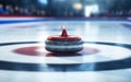 Close-up of a curling stone at a match at the central circle of the scoring house or tee button