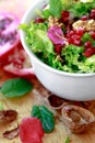 Close up of curly endive salad with pomegranate, nuts... Royalty Free Stock Photo