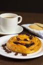 Close up custard raisin danish bread and coffee cup Royalty Free Stock Photo