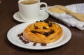 Close up custard raisin danish bread and coffee cup Royalty Free Stock Photo