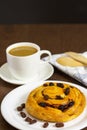 Close up custard raisin danish bread and coffee cup Royalty Free Stock Photo