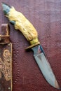 Hand made hunting knife on the brown background Royalty Free Stock Photo