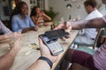 Close Up Of Customer In Restaurant Paying Bill With Contactless Phone App