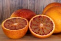 Cut blood oranges isolated on a wooden background Royalty Free Stock Photo