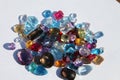 Close up of cut gemstones piled on paper