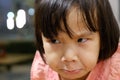 Close up of cute Asian child girl making funny face. Royalty Free Stock Photo