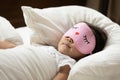 Close up cute Asian little girl wearing pink mask sleeping Royalty Free Stock Photo