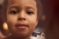 Close up cute Black little girl with big eyes looking at camera Royalty Free Stock Photo