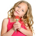 Close up of cute girl holding candy rose. Royalty Free Stock Photo