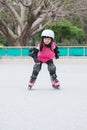 Girl play roller skating Royalty Free Stock Photo