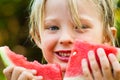 Close-up of cute happy child eating watermelon