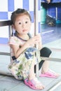 Closeup Cute little asia girl looking forward under table Royalty Free Stock Photo