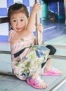 Closeup Cute little asia girl smile under table. Royalty Free Stock Photo