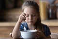 Close up cute little girl having breakfast at home Royalty Free Stock Photo