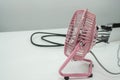 Cute pink portable usb desk fan in office