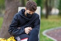 Close up cute young boy with black protective mask on face. Teenager wearing medical mask to protect from corona virus, illness Royalty Free Stock Photo