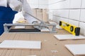 Close-up of the cutting, according to the size of the tiles for installation on the wall Royalty Free Stock Photo