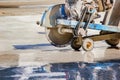 Close up cutting concrete machine are working on wet floor Royalty Free Stock Photo