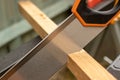 close up of cutting wood with a tenon saw