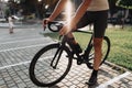 Close up of cyclist in sportswear sitting on bike outdoors Royalty Free Stock Photo