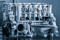 Close-up of the cylinder block in the light blue. Automotive part, machine part