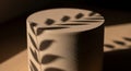 Close-up of a cylindrical object with leaf shadows Royalty Free Stock Photo