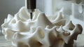 Close-up of a 3D printer creating a complex design from a digital model Royalty Free Stock Photo