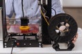 Close up of a 3d printer creating a new object