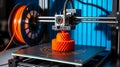 Close-up 3D printer creating red-orange gear on black build plate Royalty Free Stock Photo