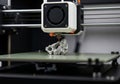Close up of a 3d printer nozzle creating a detailed object layer by layer Royalty Free Stock Photo