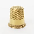 Ornate Golden Thimble with Textured Surface on a White Background sewing needlework Royalty Free Stock Photo