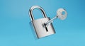 Shiny Silver Padlock with Key Inserted Against a Bright Blue Background security safety Royalty Free Stock Photo