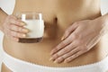 Close Up Of Dairy Intolerant Woman Holding Glass Of Milk Royalty Free Stock Photo