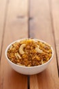 Close-Up of Dal Biji or Dal moth, made with roasted Masoor Dal black lentils and small besan sev, garnished with fried cashew