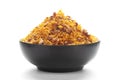 Close-Up Dal Bijli or Dal moth in a black ceramic bowl, made with roasted Masoor Dal black lentils. Indian spicy snacks