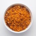 Close-Up Dal Bijli or Dal moth in a white ceramic bowl, made with roasted Masoor Dal black lentils. Indian spicy snacks