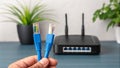 Close-up of damaged Ethernet cable with exposed wires. Technology connectivity issues. Router and network troubleshooting.