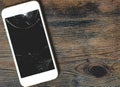 Close up of damaged smartphone with cracked screen Royalty Free Stock Photo