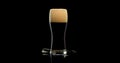 Close up dark beer and beer with foam on a black background Royalty Free Stock Photo