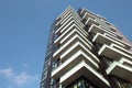 Close up dark brown futuristic architecture of an apartment building on a background of blue sky. 01.2020 Milan Royalty Free Stock Photo