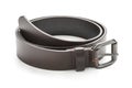 Close-up of dark brown leather belt strap curled up on a white background. Isolated with clipping path photo Royalty Free Stock Photo