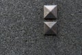 Closeup granite slab with two decorative pyramid