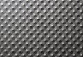 Close-up of a dark gray metal plate with bulges, pimples Royalty Free Stock Photo