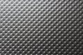 Close-up of a dark gray metal plate with bulges, pimples Royalty Free Stock Photo